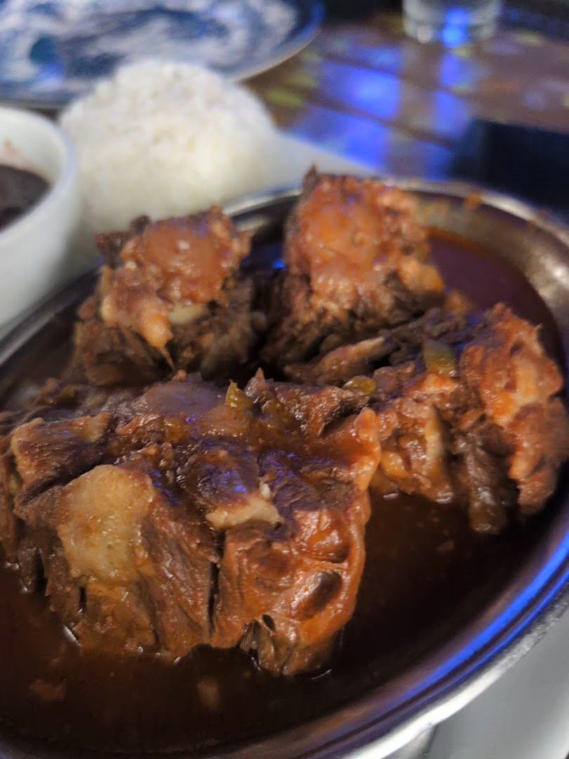 Plates of Cuban food on a restaurant table
